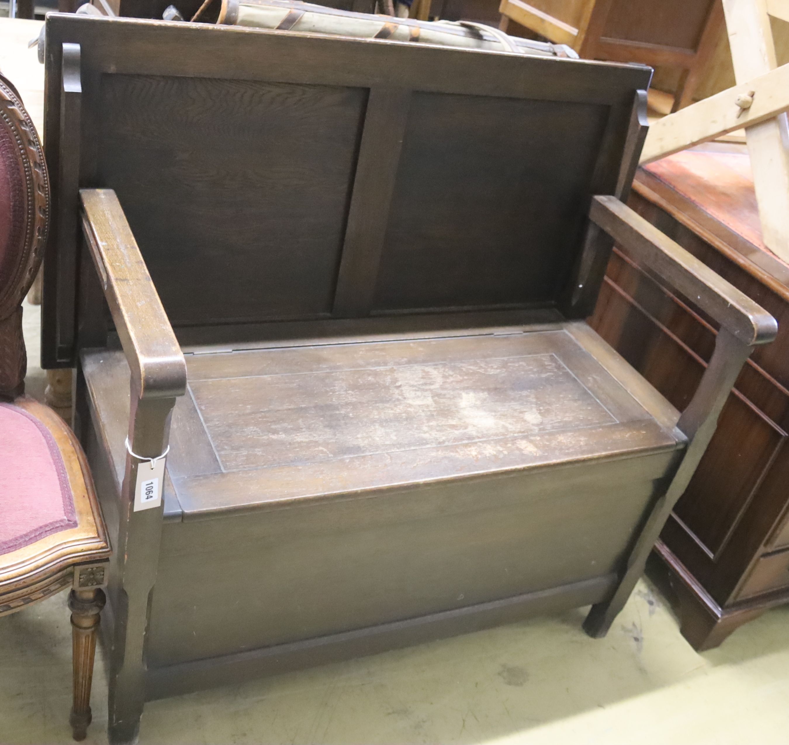 An 18th century style oak monk's bench, width 107cm, depth 54cm, height 99cm